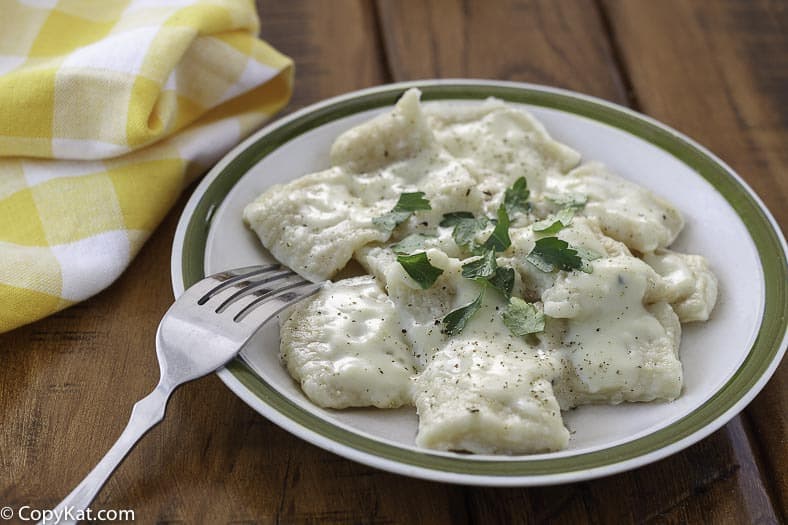 Homemade Cracker Barrel Dumplings and a fork on a plate.