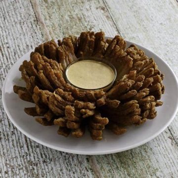 Homemade copycat Outback Steakhouse Bloomin Onion on a white plate.