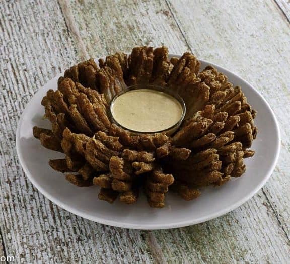 Homemade copycat Outback Steakhouse Bloomin Onion on a white plate.