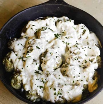 meatballs in creamy mushroom sauce in a skillet