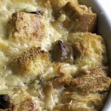 a bowl of bread pudding with raisins