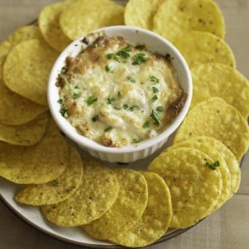 hot crab dip and tortilla chips on a platter