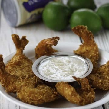 Coconut shrimp with pina colada dipping sauce on a plate