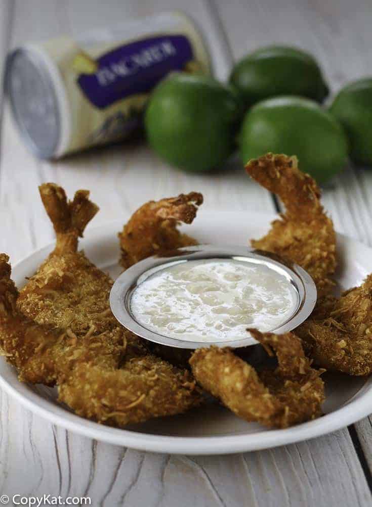 Coconut shrimp with pina colada dipping sauce on a plate 