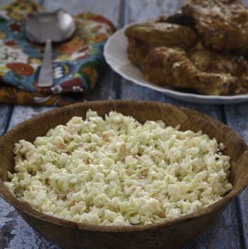Homemade copycat KFC coleslaw in a small wood bowl.