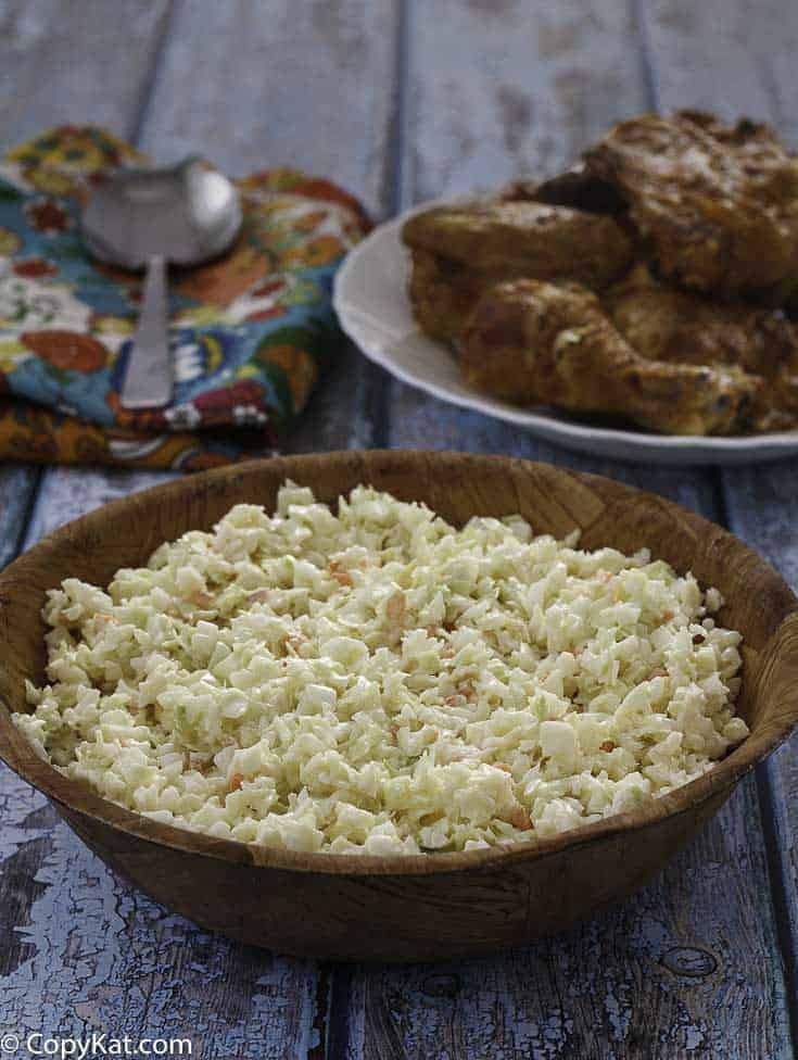 Homemade copycat KFC coleslaw in a small wood bowl.