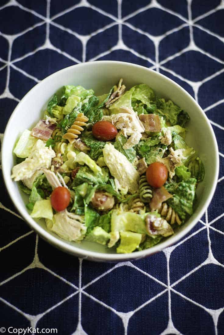 A chicken and lettuce salad with honey mustard dressing. 