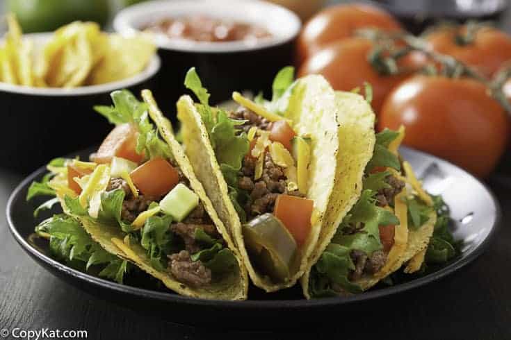 three beef tacos on a plate
