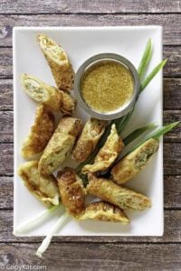 homemade Benihana magic mustard sauce and egg rolls on a platter