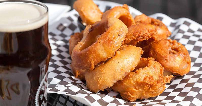 Recreate the famous Simon and Seafort's Beer Battered Onion Rings at home with this copycat recipe.   