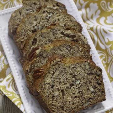 4 slices of banana bread with pecans on a plate