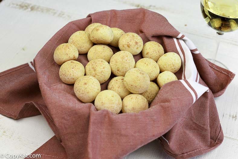 A basket of homemade Fogo De Chao cheese bread puffs