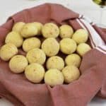 A basket filled with Brazilian cheese bread puffs