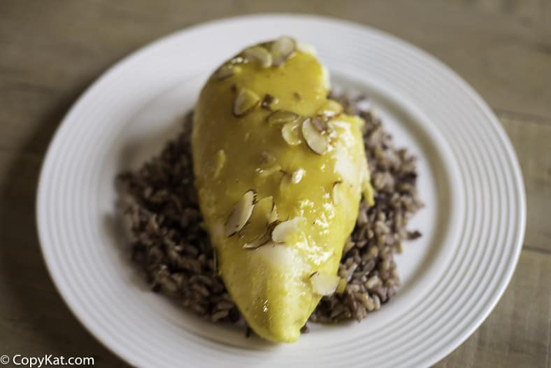 A chicken breast made with a lemon sauce and topped with slivered almonds. 