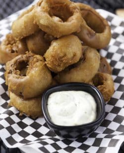 You can make Simon and Seaforts Beer Battered Onion Rings at home with this easy copycat recipe.