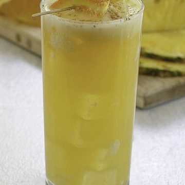 A soggy dollar painkiller cocktail in a highball glass