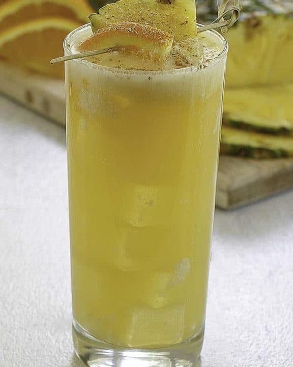 A soggy dollar painkiller cocktail in a highball glass