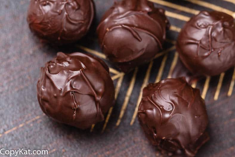 Chocolate truffles on a plate.