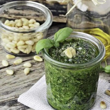 a jar of homemade pesto with pine nuts