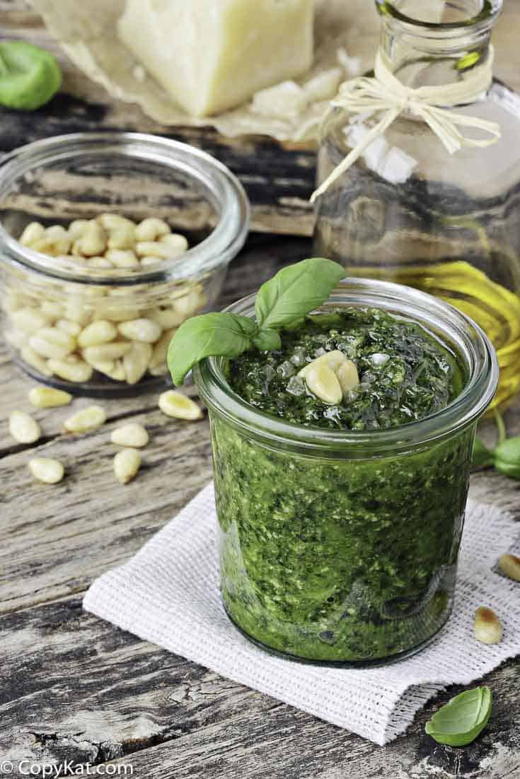 a jar of homemade pesto with pine nuts