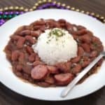 a bowl of red beans and rice with sausage