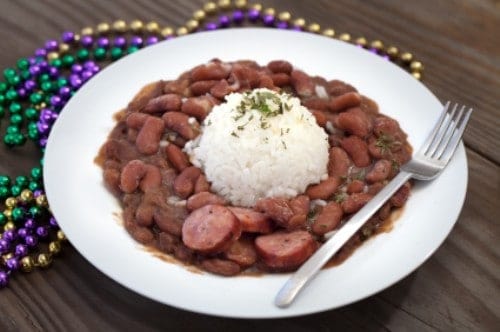 a bowl of red beans and rice with sausage