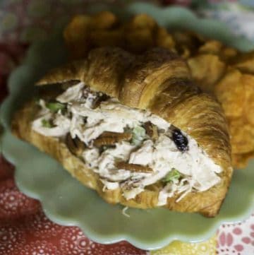 Chicken salad with dried fruit in a croissant.