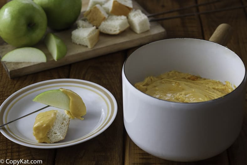 Melting pot cheddar cheese fondue served in a bowl. 