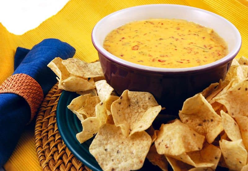 rotel cheese dip in a bowl next to tortilla chips