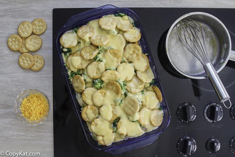 Homemade copycat Cracker Barrel Broccoli Cheddar Chicken Casserole in a blue baking dish.