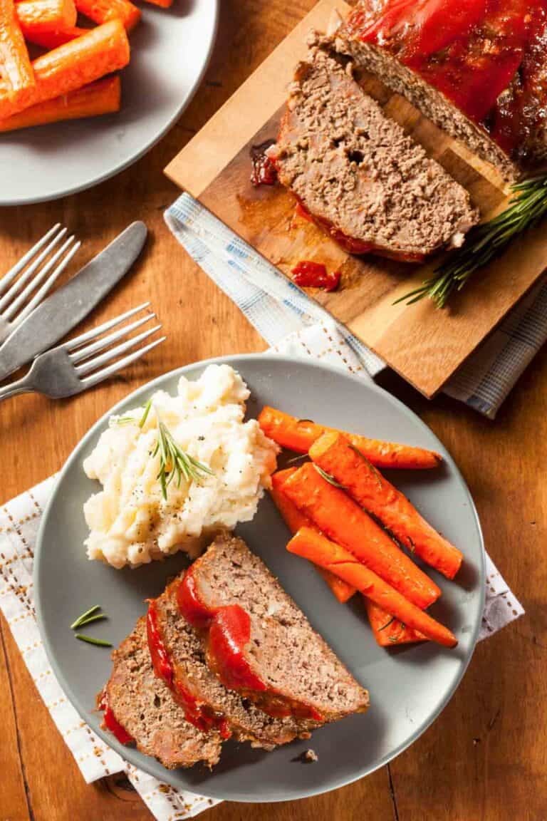 Meatloaf, mashed potatoes, and carrots served for dinner.