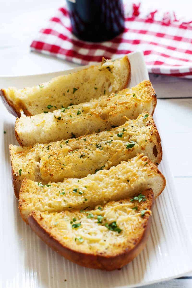 Slices of homemade Parmesan Cheese Garlic Bread on a plate