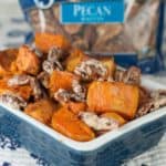 Roasted Sweet Potatoes with Candied Pecans in a baking dish