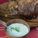 Homemade copycat Outback Steakhouse Tiger Dill Sauce in a bowl in front of a prime rib roast.