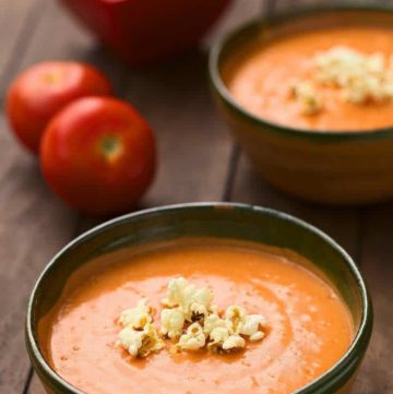 two bowls of creamy tomato soup