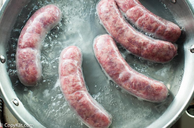 Cooking Johnsonville sausages for pretzel wrapped brats