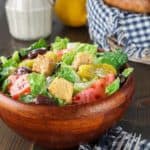 Homemade copycat Olive Garden Salad Dressing and a salad.
