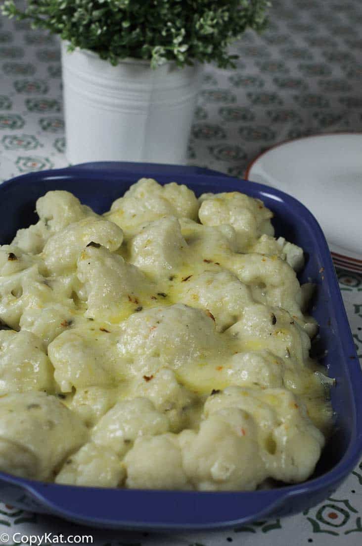 Baked Pepper Jack Cauliflower Gratin in a baking dish on a table.