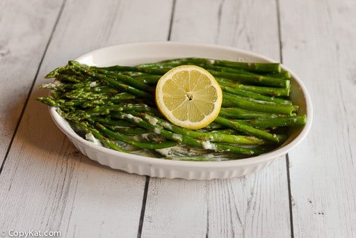 asparagus with cream sauce in a white dish