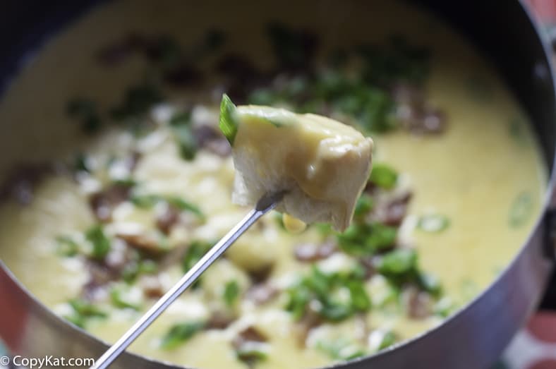 You can dip into this flavorful bacon Cheddar cheese fondue. 