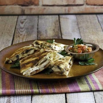 Homemade copycat Alice Springs Quesadilla on a brown plate.