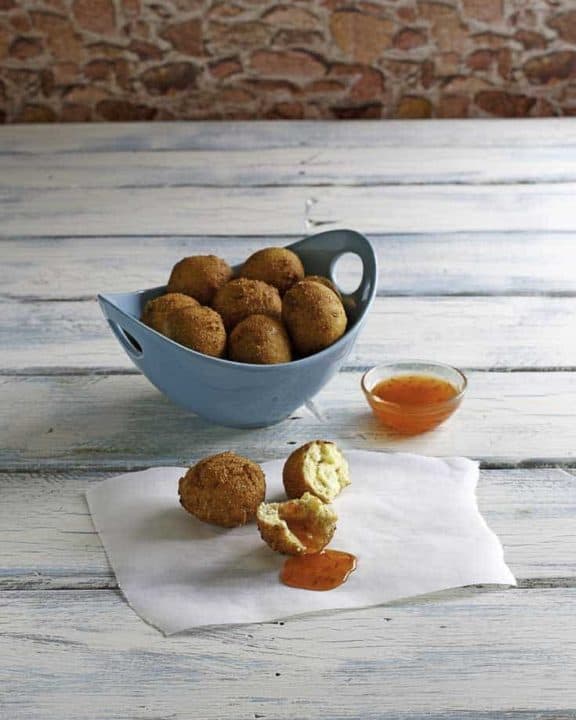 Homemade Captain Ds hush puppies in a blue bowl