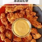 a bowl of copycat chick fil-a sauce and chicken nuggets