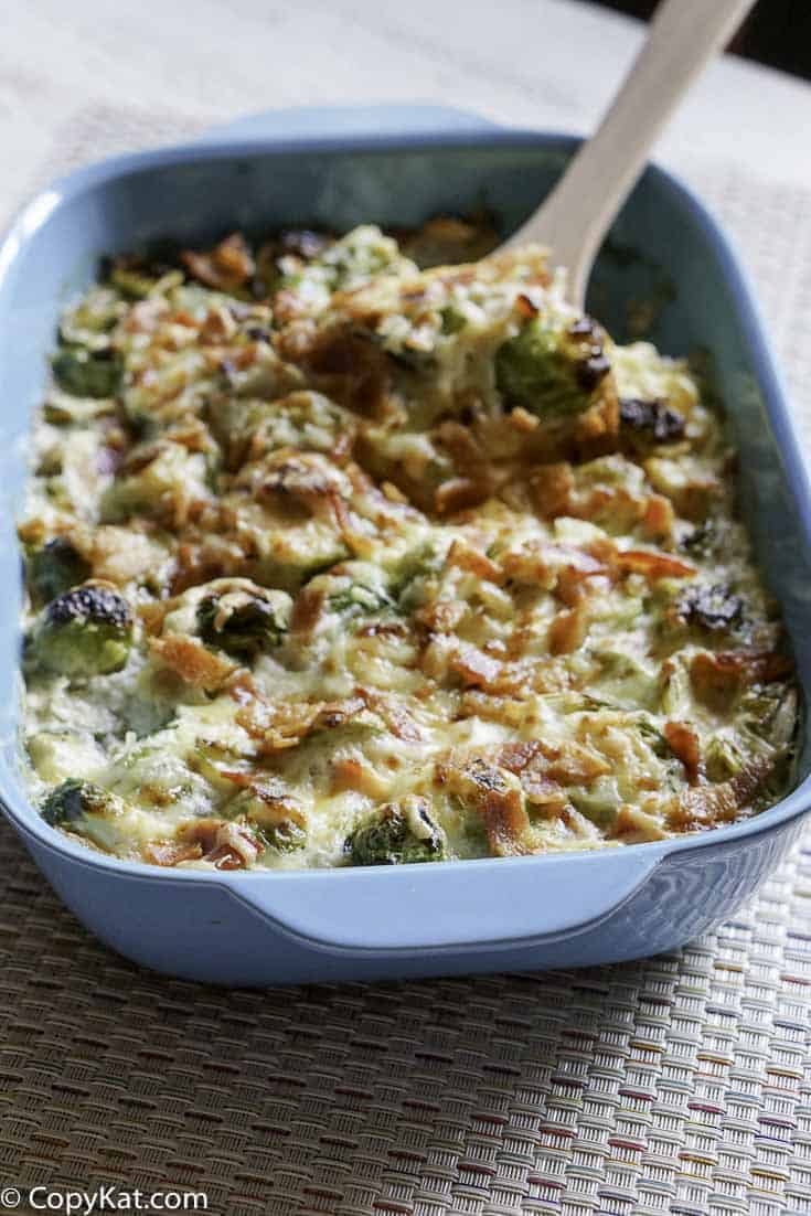 Brussels Sprouts Au Gratin in a blue baking dish