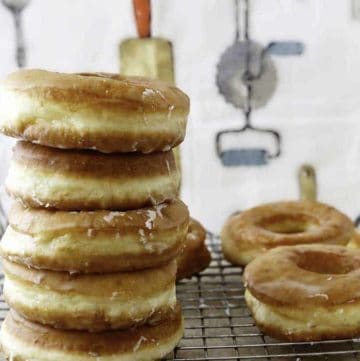 a stack of homemade Krispy Kreme Glazed Donuts