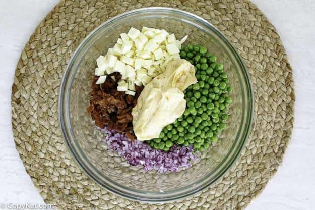 pea salad ingredients in a bowl.