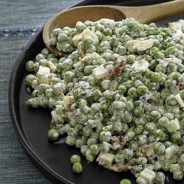 a plate of homemade pea salad with cheese and bacon