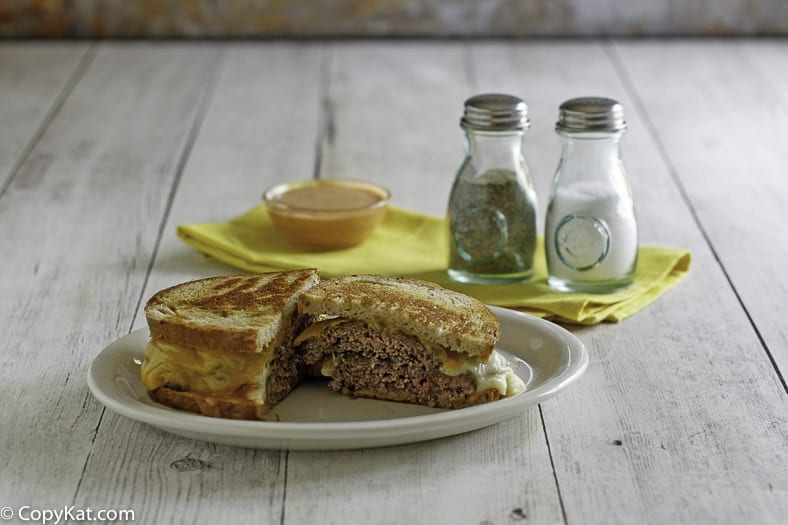 Homemade Steak and Shake Frisco Melt cut in half on a plate