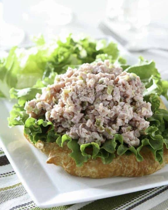 Homemade ham salad and lettuce on a croissant