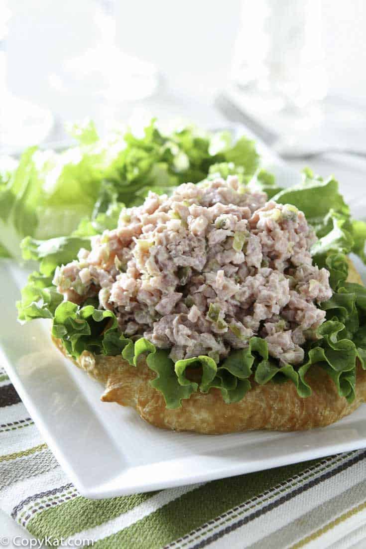 Homemade ham salad and lettuce on a croissant
